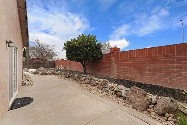 a view of a chairs and table in the patio