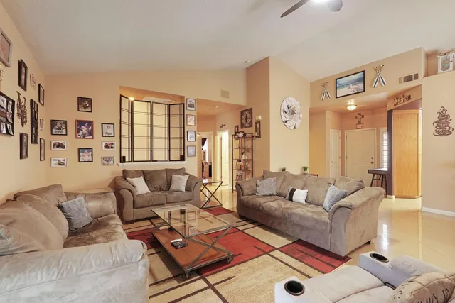 a living room with furniture and a window