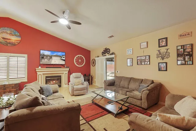 a living room with furniture and a window