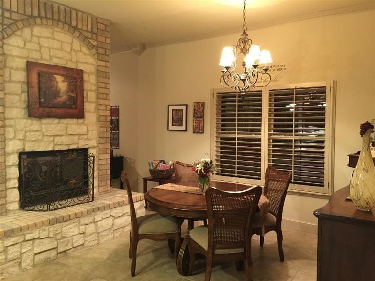 3908 104th Street Lubbock, TX 79423 - Photo 9 of 10 Dining Area with Fireplace