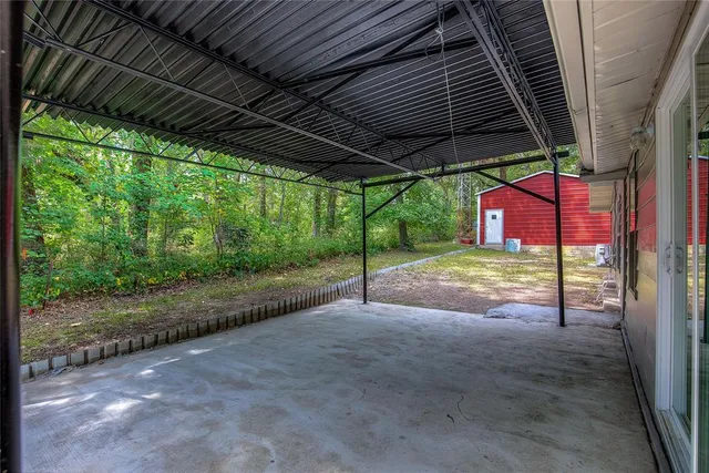 a view of a house with backyard and porch