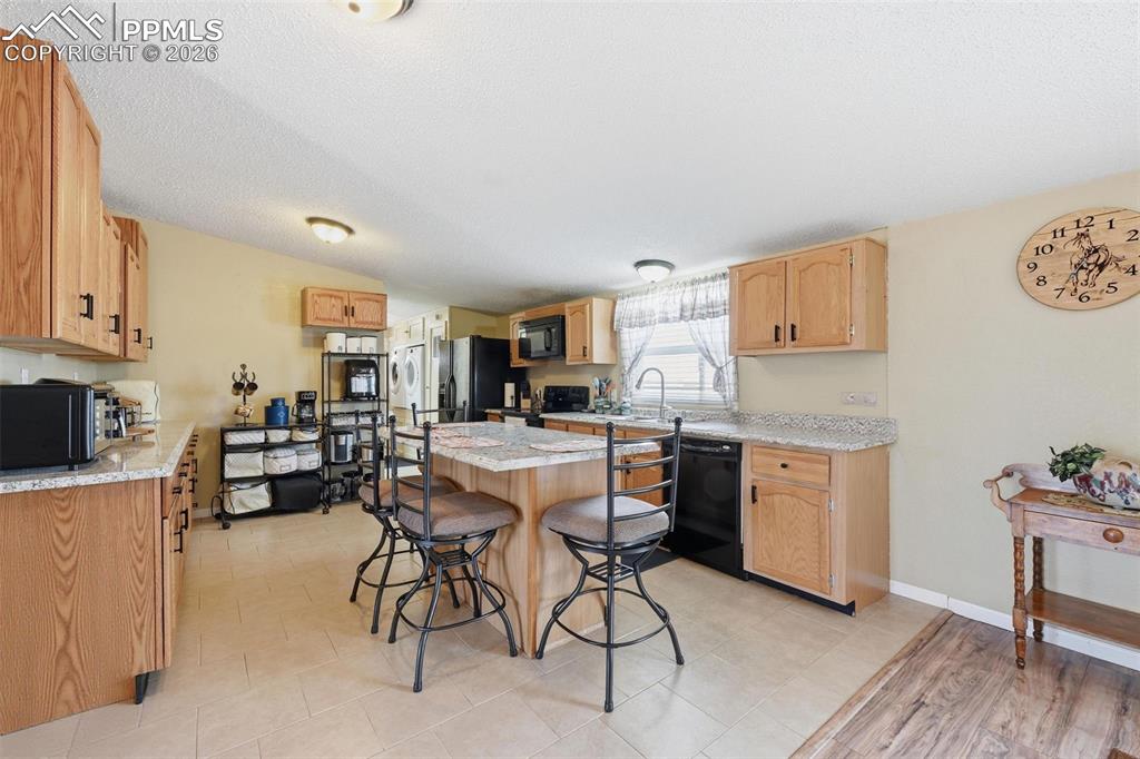20985 McDaniels Road Calhan, CO 80808 - Photo 21 of 41 a kitchen with a table and chairs in it