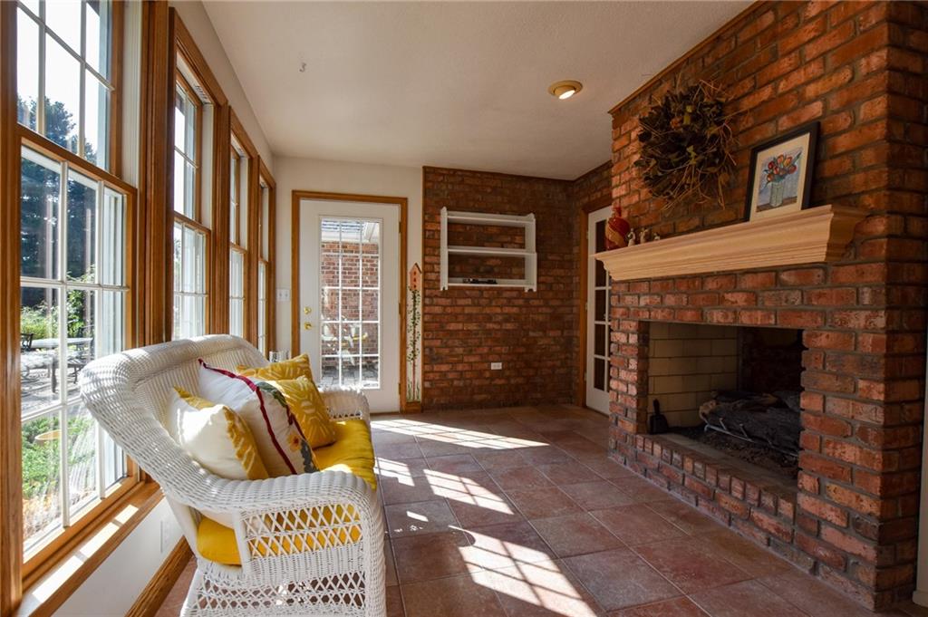 115 Shepperd Drive Butler, PA 16002 - Photo 11 of 24 a living room with furniture a fireplace and a floor to ceiling window
