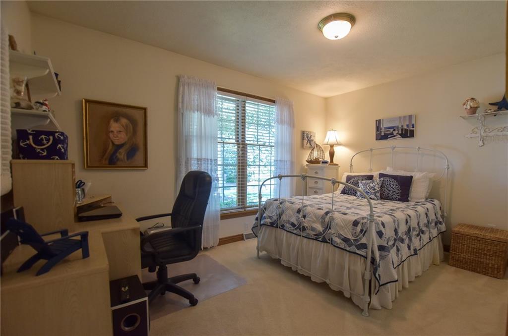 115 Shepperd Drive Butler, PA 16002 - Photo 18 of 24 a bed room with a bed and a chair