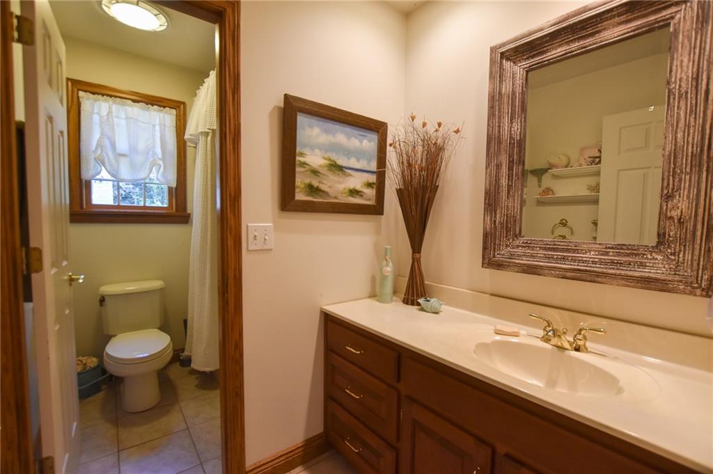 115 Shepperd Drive Butler, PA 16002 - Photo 19 of 24 a bathroom with a toilet sink and mirror