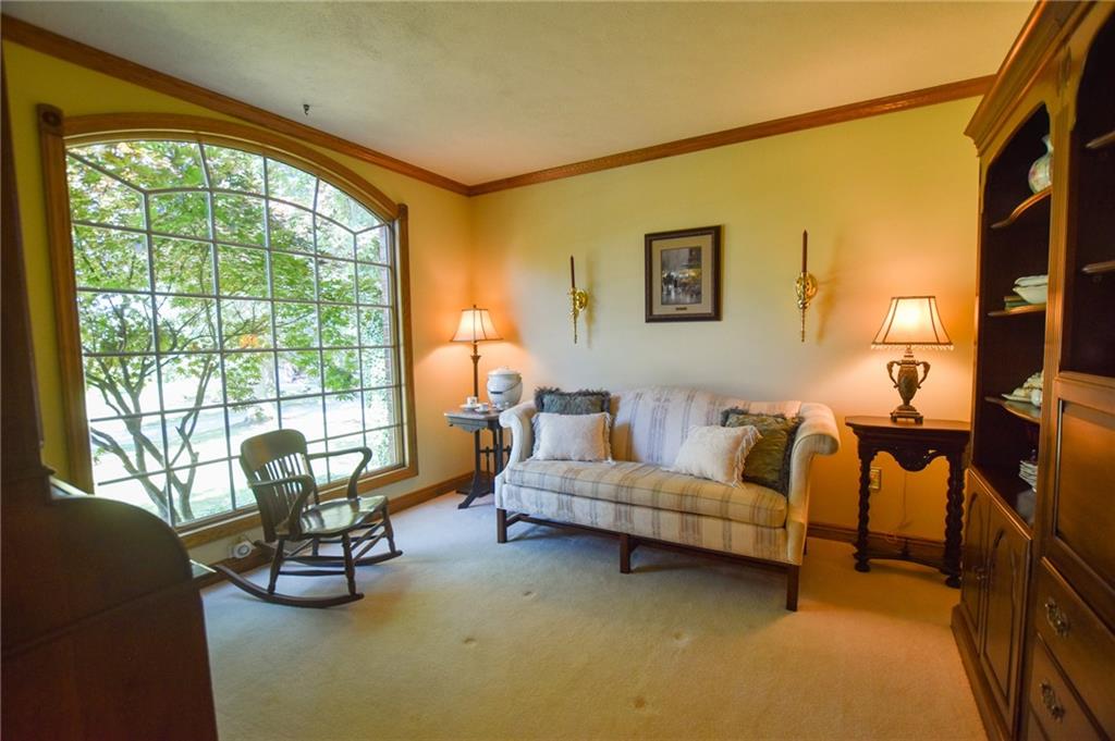 115 Shepperd Drive Butler, PA 16002 - Photo 3 of 24 a living room with furniture and a floor to ceiling window