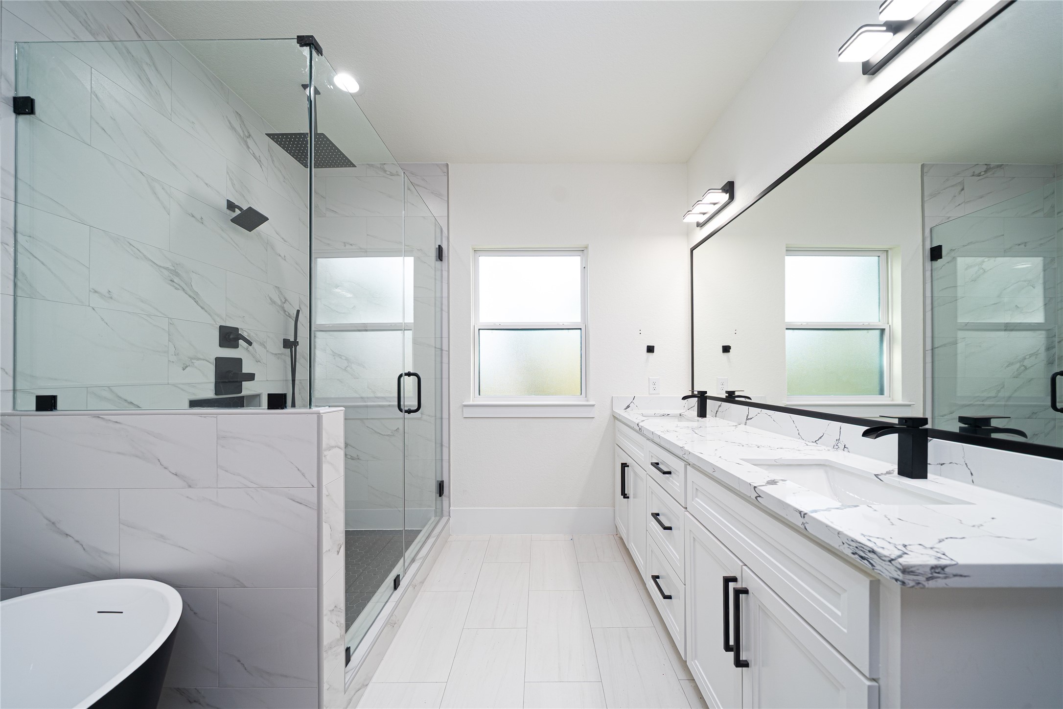 2503 Parker Road Houston, TX 77093 - Photo 9 of 17 a bathroom with a granite countertop sink a toilet a mirror and shower