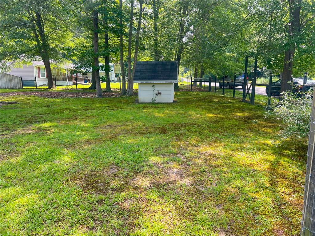 340 Womack Avenue Dallas, GA 30157 - Photo 6 of 29 a front view of a house with a garden
