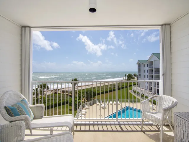 a view of a balcony with furniture