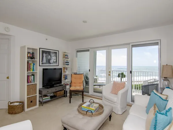 a living room with furniture and a lamp