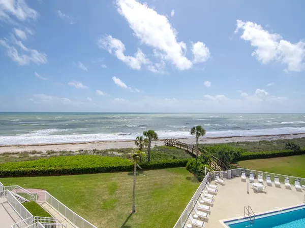 a view of swimming pool with a balcony