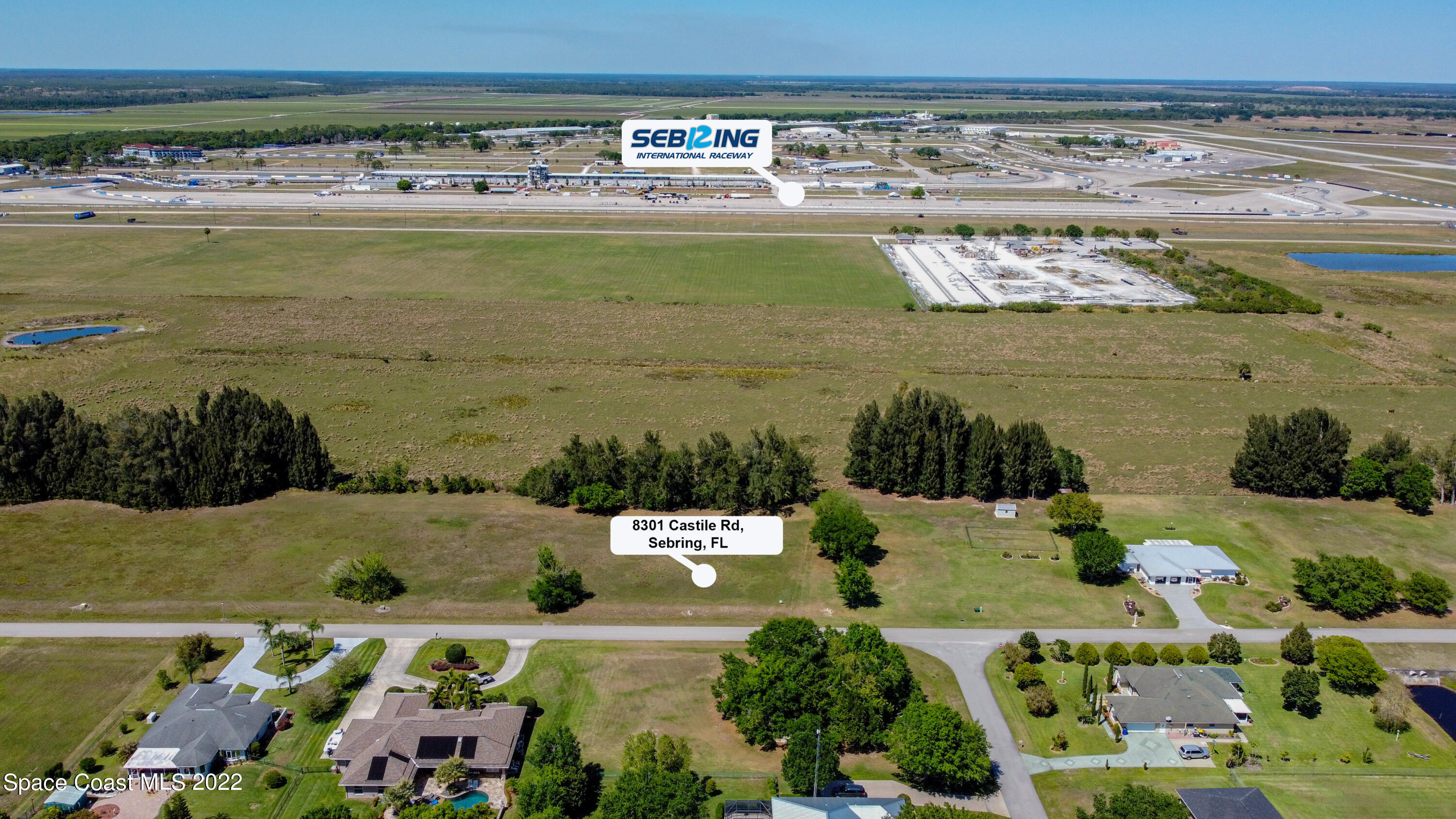 8301 Castile Road Sebring, FL 33876 - Photo 16 of 25 a view of a lake with a building in the background