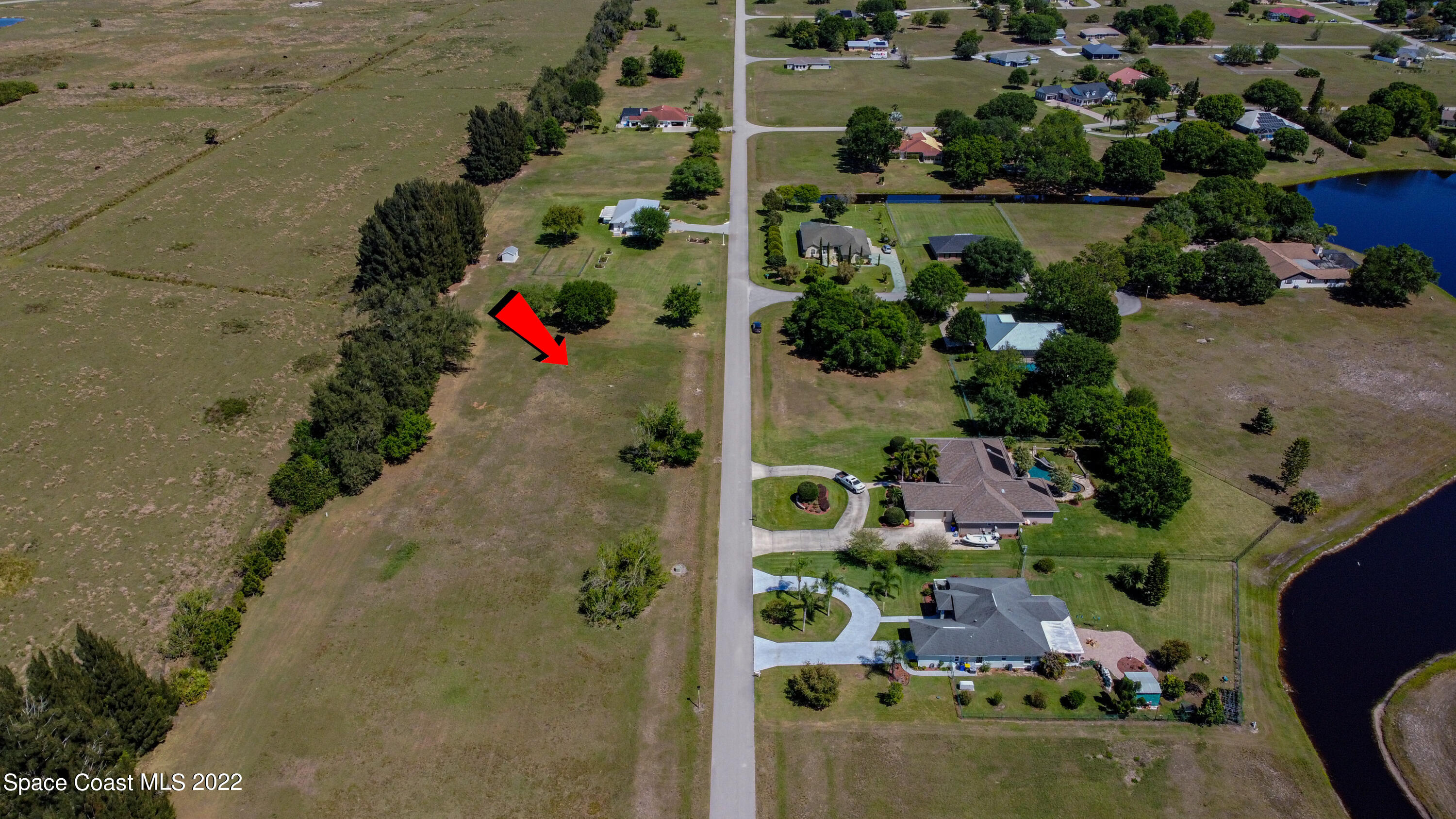 8301 Castile Road Sebring, FL 33876 - Photo 9 of 25 an aerial view of a house with a yard and garden