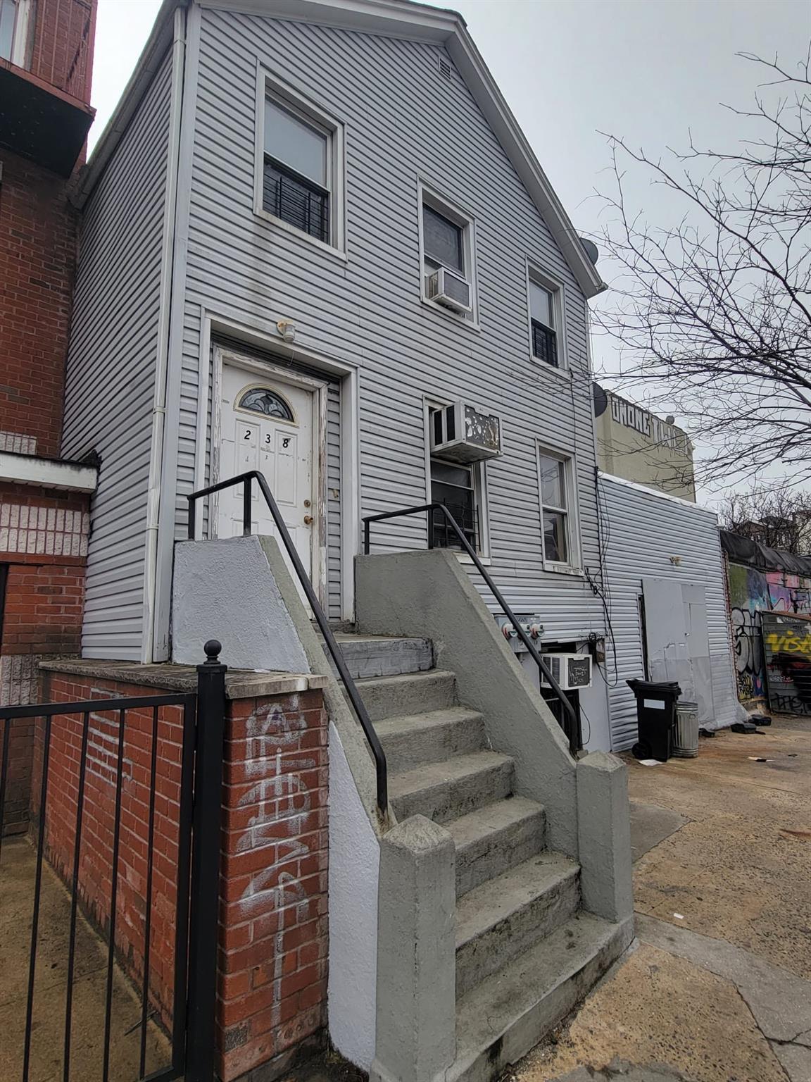 238 Kosciuszko Street Brooklyn, NY 11221 - Photo 3 of 3 a view of entryway with a front door
