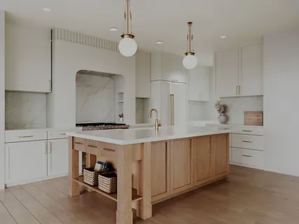 a kitchen with a stove a sink and a refrigerator