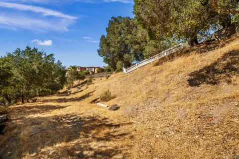 a view of mountain view with lots of trees
