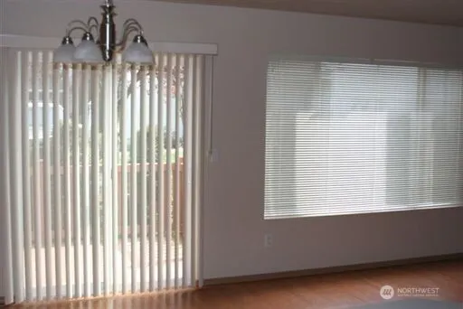 a bathroom with a large window and a shower