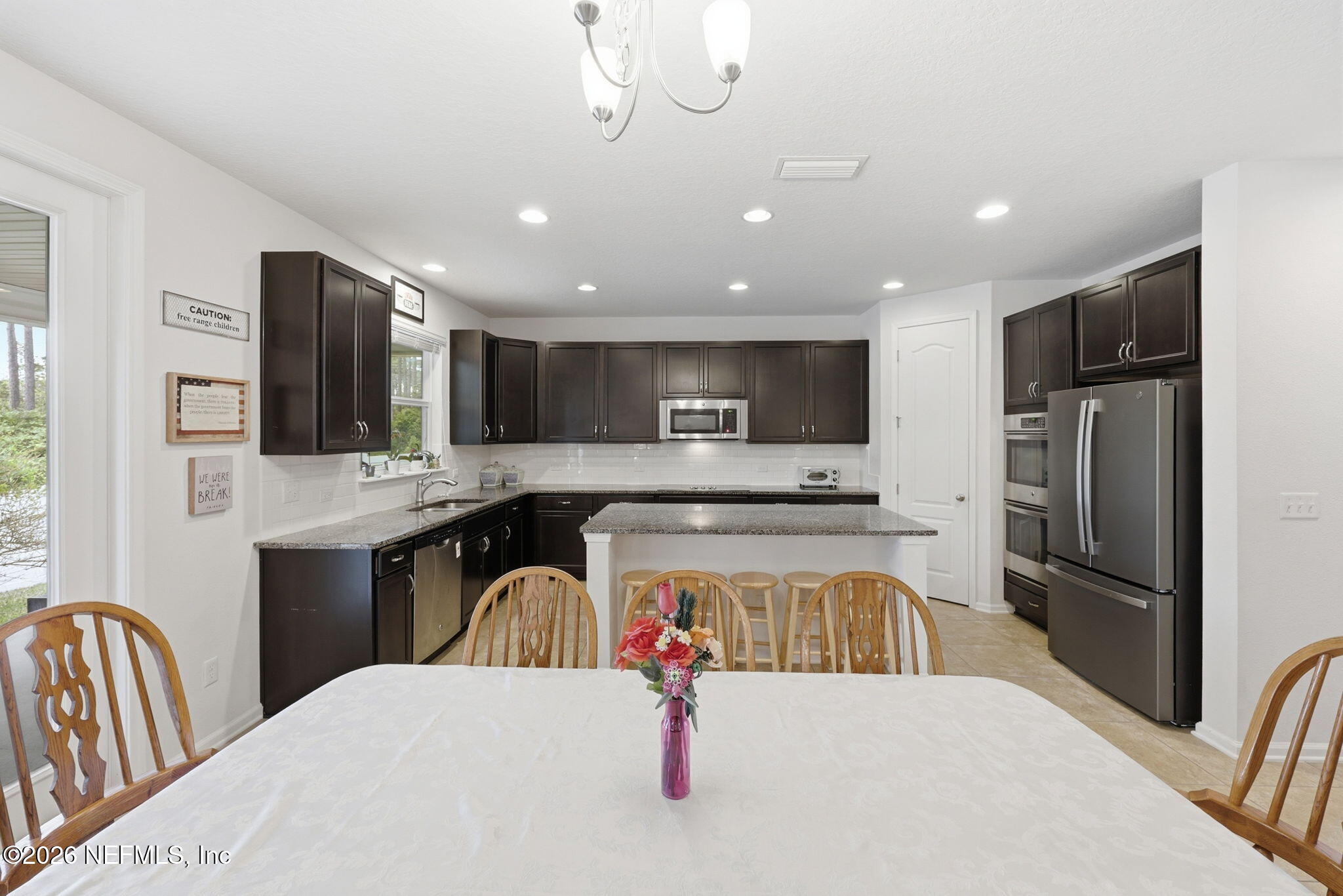1090 Wetland Ridge Circle Middleburg, FL 32068 - Photo 16 of 87 Dining to Kitchen