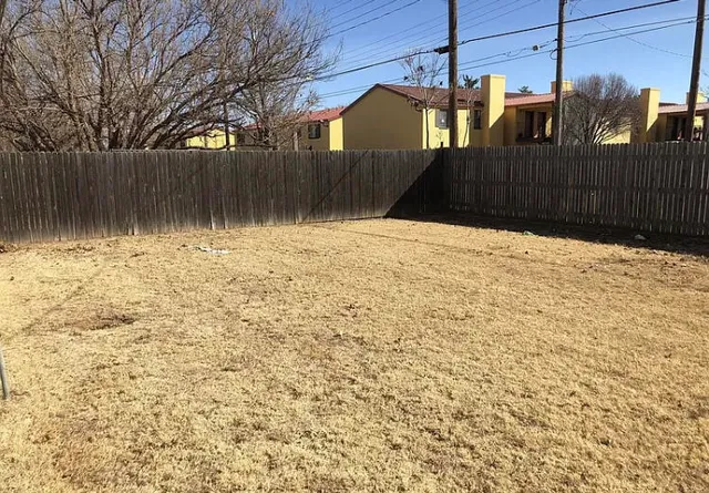 a street view with wooden fence