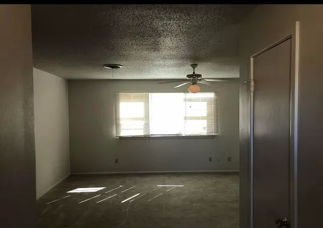 a view of an empty room and window