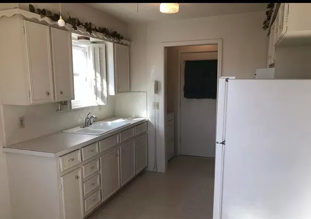 a bathroom with a sink vanity and a mirror
