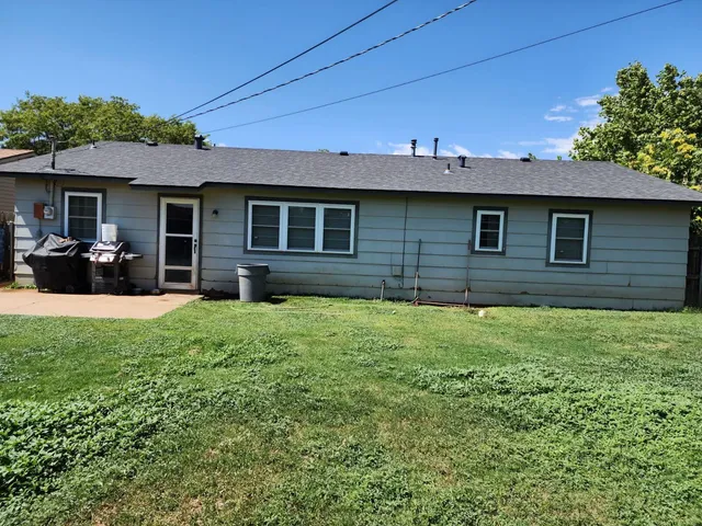 a brick house with a yard