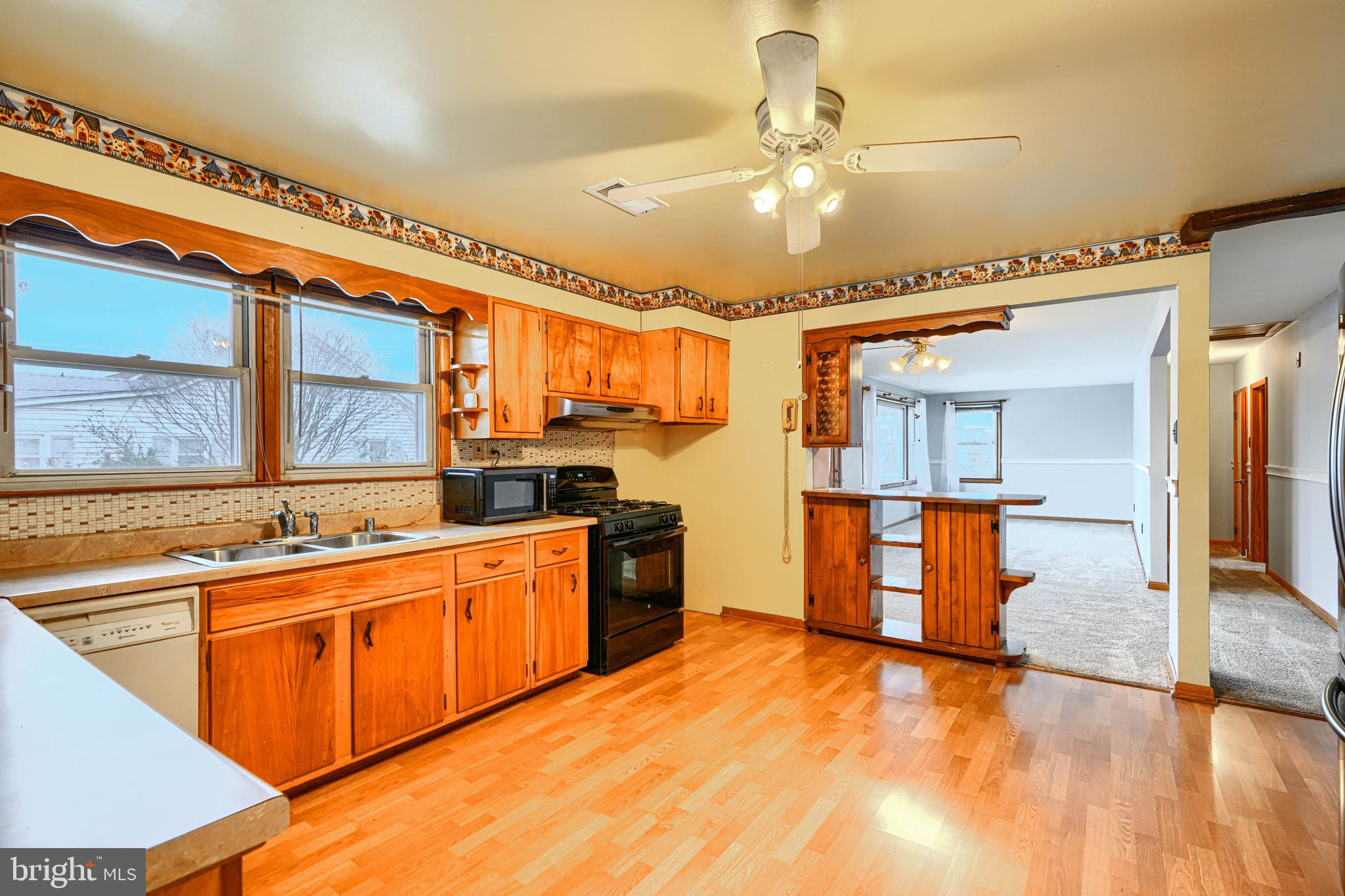 3118 Lynch Road Sparrows Point, MD 21219 - Photo 24 of 46 a large kitchen with stainless steel appliances granite countertop a sink and cabinets