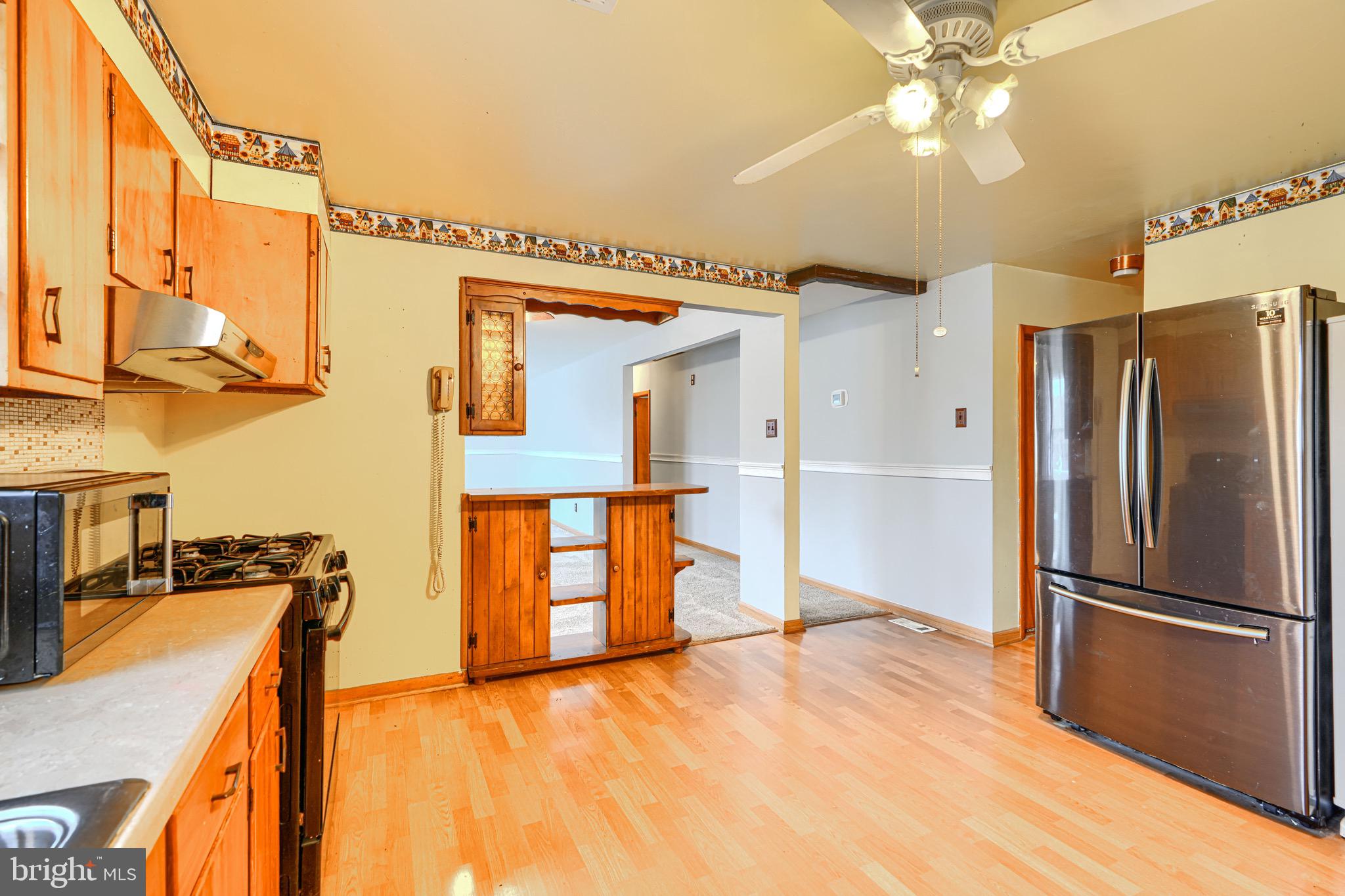 3118 Lynch Road Sparrows Point, MD 21219 - Photo 25 of 46 a view of a kitchen with a sink and a refrigerator
