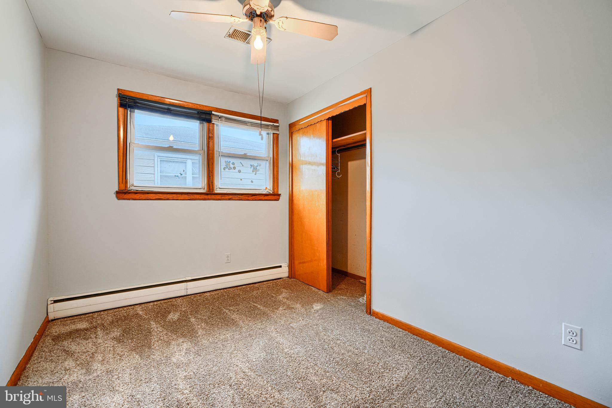 3118 Lynch Road Sparrows Point, MD 21219 - Photo 30 of 46 an empty room with a chandelier fan and windows