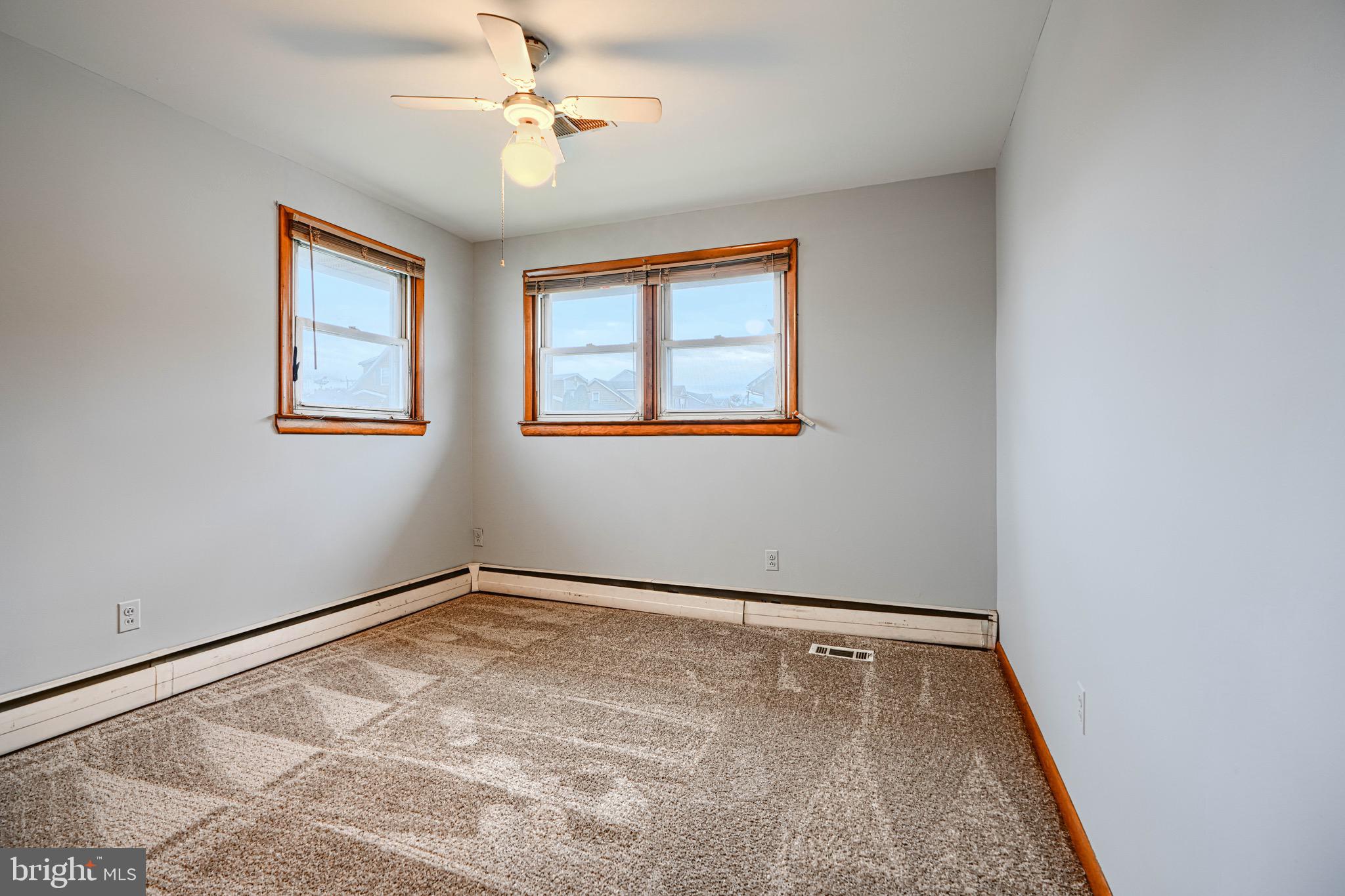 3118 Lynch Road Sparrows Point, MD 21219 - Photo 31 of 46 an empty room with windows and fan