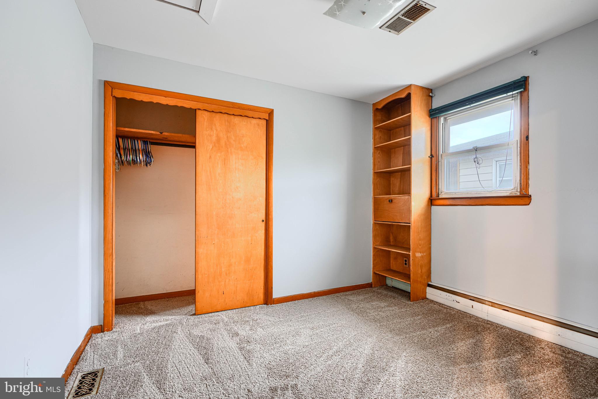 3118 Lynch Road Sparrows Point, MD 21219 - Photo 36 of 46 an empty room that has a window and closet