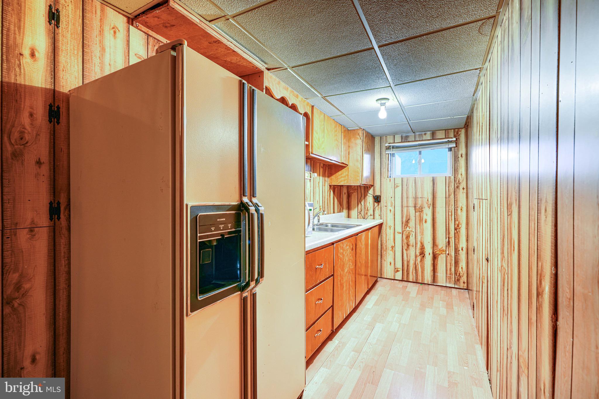 3118 Lynch Road Sparrows Point, MD 21219 - Photo 43 of 46 a view of hallway with stainless steel appliances granite countertop furniture and a shower