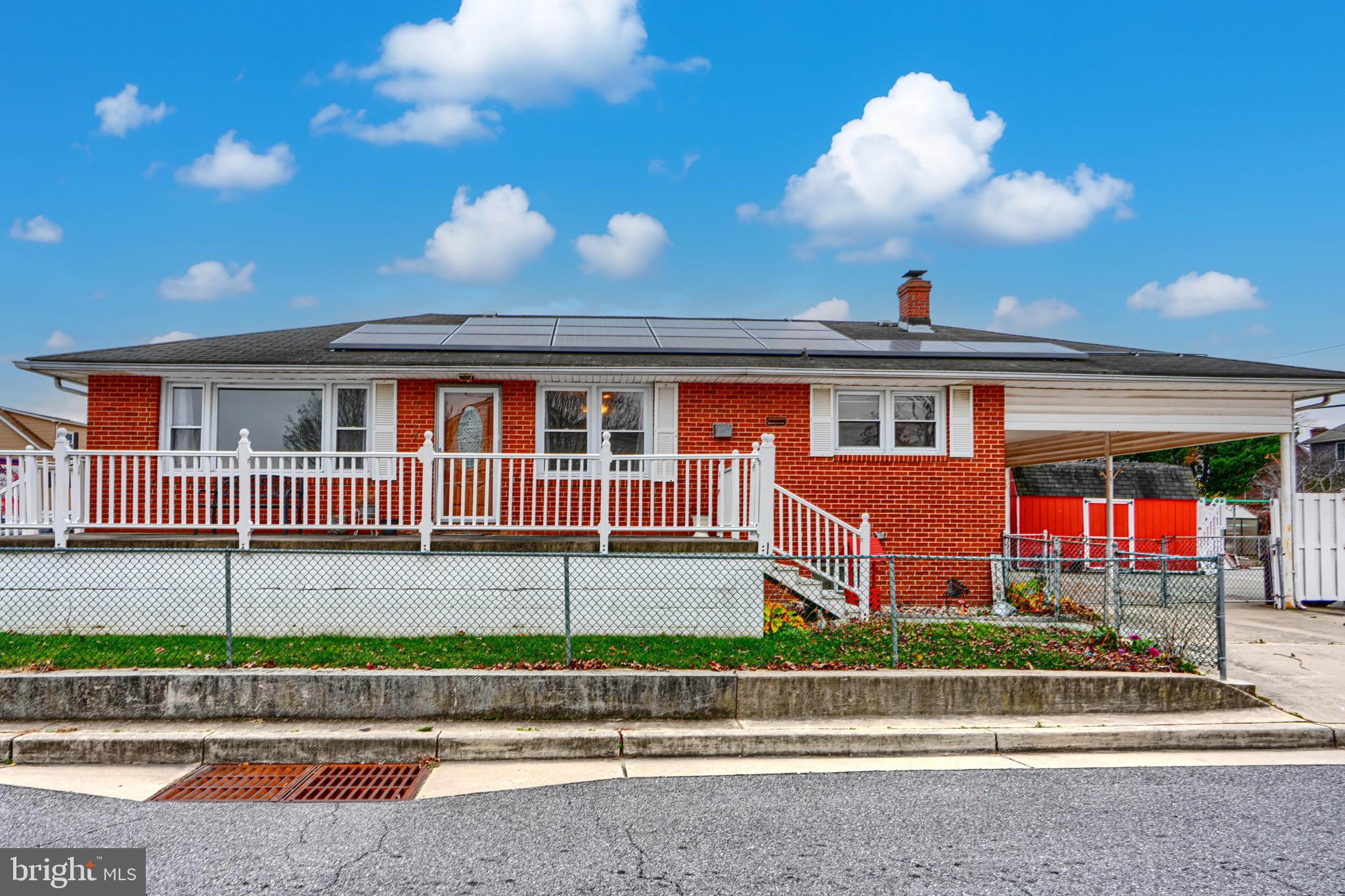 3118 Lynch Road Sparrows Point, MD 21219 - Photo 5 of 46 a view of a house with a swimming pool and a yard
