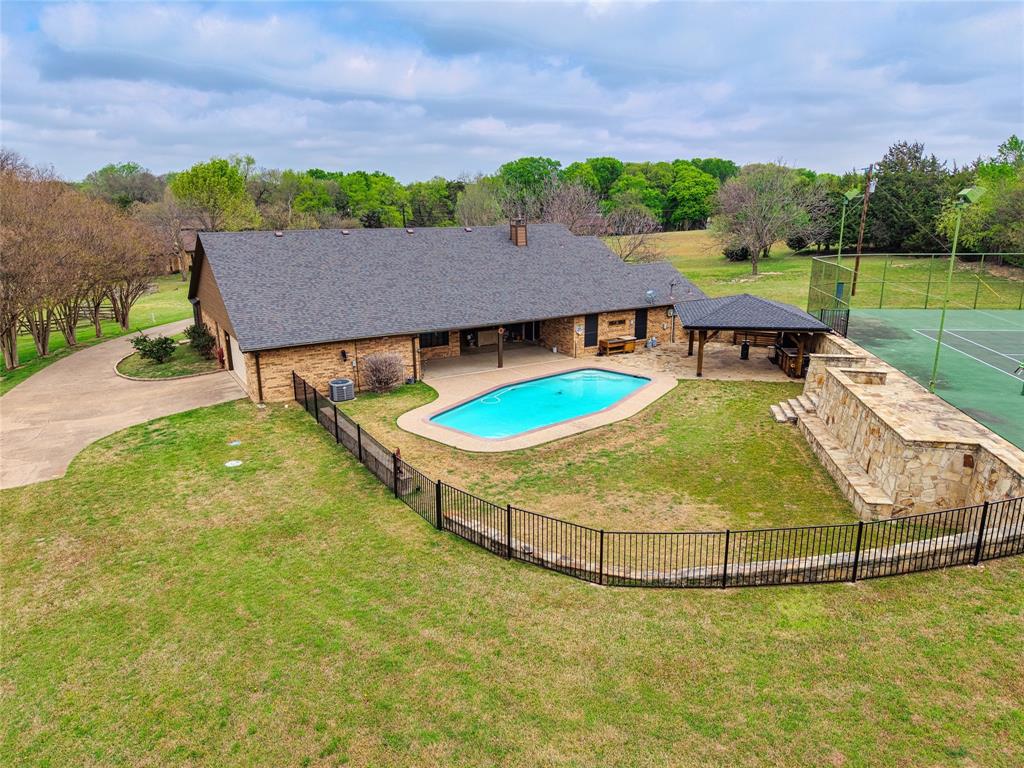 5840 Crystal Drive Midlothian, TX 76065 - Photo 32 of 36 an aerial view of a house with a swimming pool
