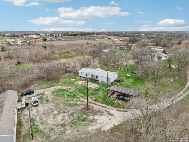 a view of a yard with an outdoor seating