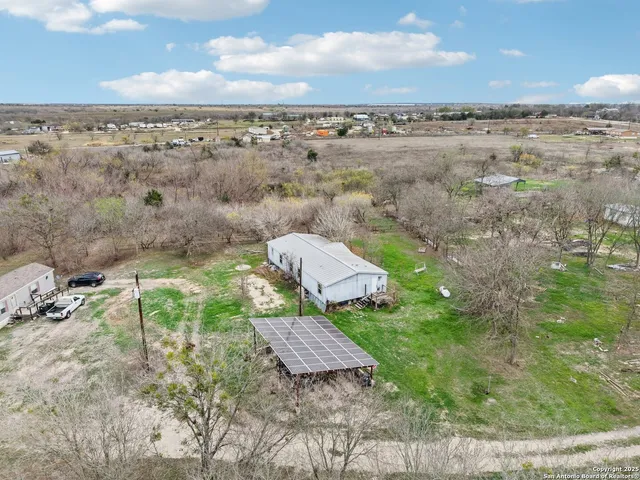 a view of a terrace with a bench and trees