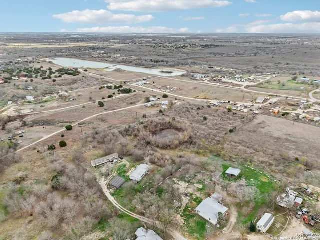 an aerial view of beach and building