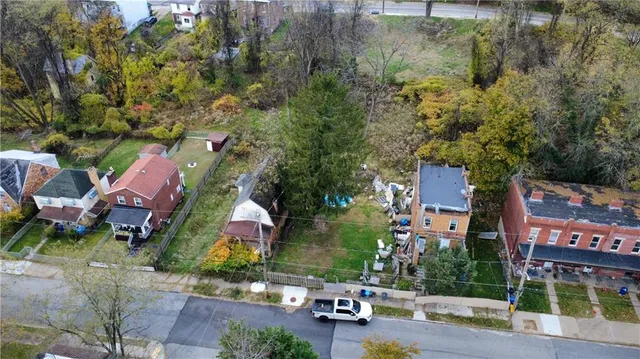 an aerial view of houses with yard