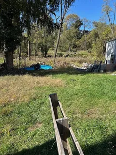 a backyard of a house with lots of green space