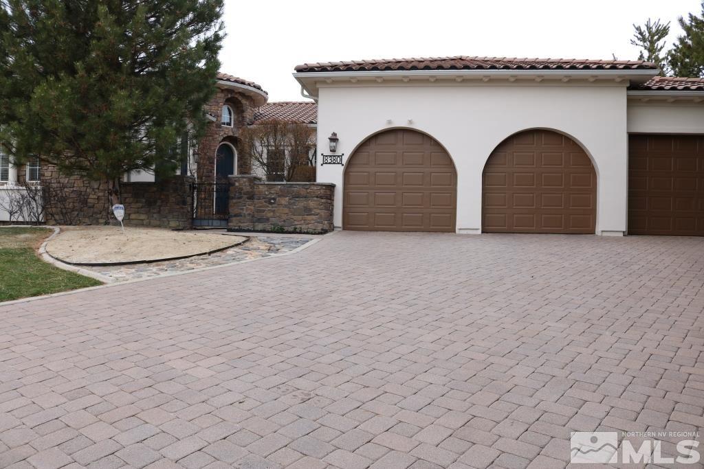 8380 Cinnamon Ridge Lane Reno, NV 89523 - Photo 1 of 17 a front view of a house with a yard
