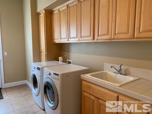 8380 Cinnamon Ridge Lane Reno, NV 89523 - Photo 13 of 17 a utility room with dryer and washer