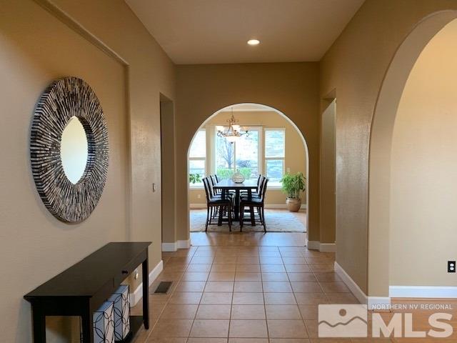 8380 Cinnamon Ridge Lane Reno, NV 89523 - Photo 3 of 17 a view of a livingroom with furniture and a mirror