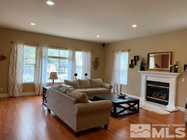 8380 Cinnamon Ridge Lane Reno, NV 89523 - Photo 6 of 17 a living room with furniture and a fireplace