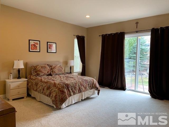 8380 Cinnamon Ridge Lane Reno, NV 89523 - Photo 7 of 17 a spacious bedroom with a bed and a large window