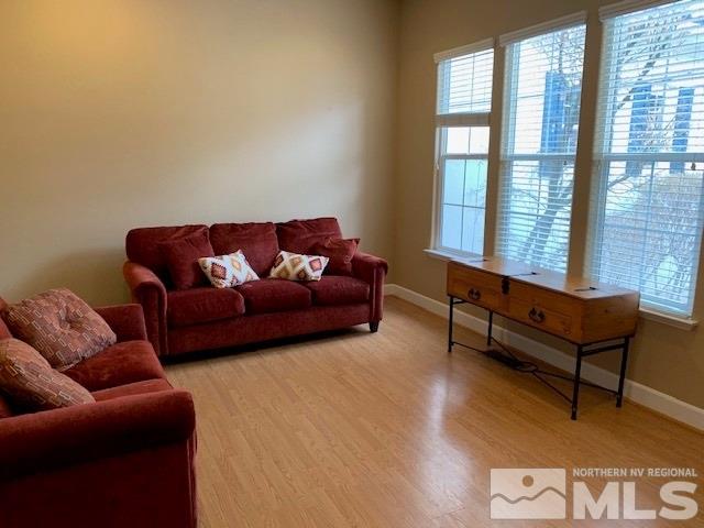 8380 Cinnamon Ridge Lane Reno, NV 89523 - Photo 9 of 17 a living room with furniture and a window