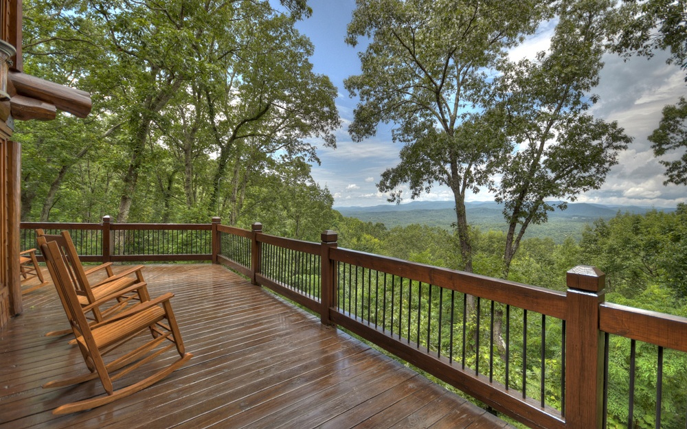 602 Overlook Drive Blue Ridge, GA 30513 - Photo 3 of 4 a view of a balcony with wooden floor and outdoor seating