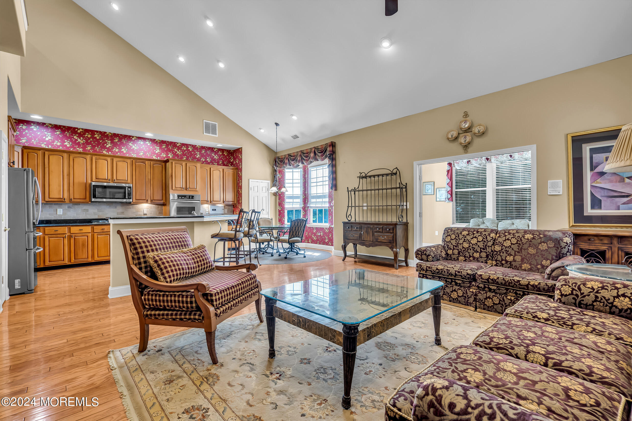 14 Headwaters Place Barnegat, NJ 08005 - Photo 19 of 68 a living room with fireplace furniture and a kitchen view