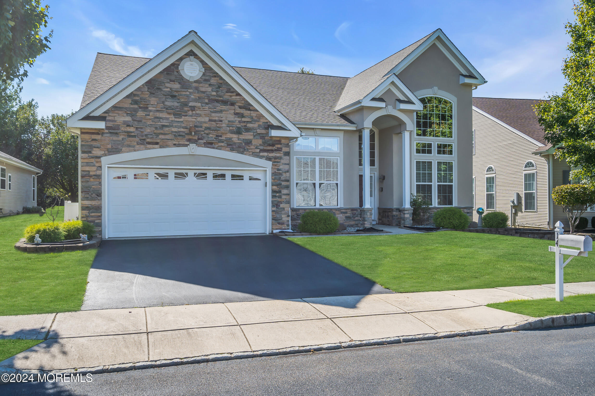 14 Headwaters Place Barnegat, NJ 08005 - Photo 2 of 68 a front view of a house with a yard and garage