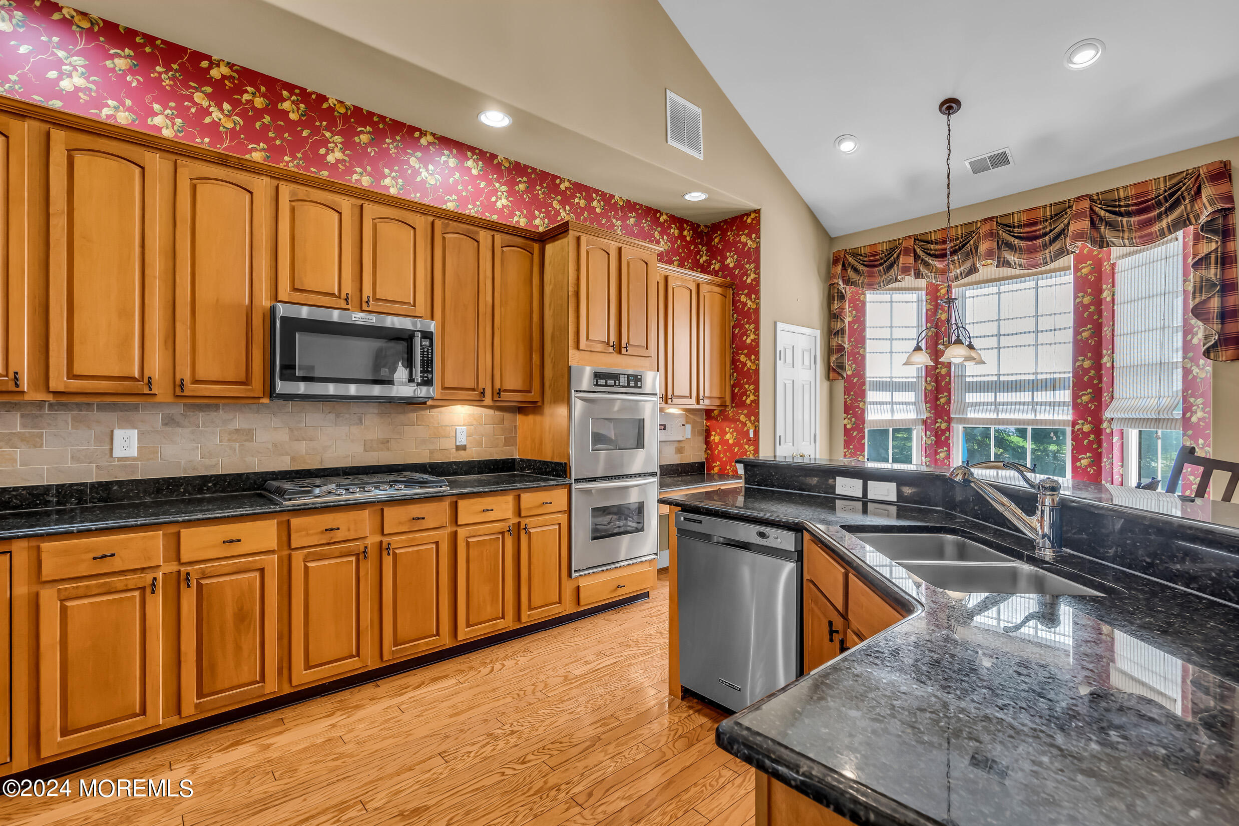 14 Headwaters Place Barnegat, NJ 08005 - Photo 25 of 68 a kitchen with stainless steel appliances granite countertop a sink stove and microwave