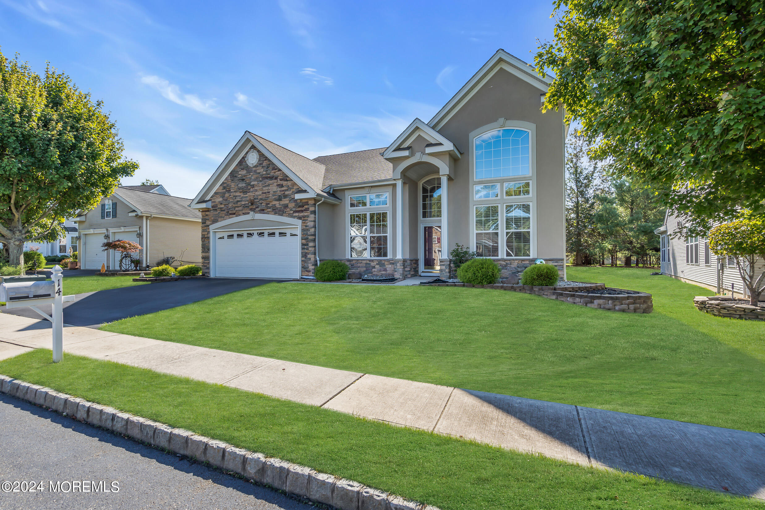 14 Headwaters Place Barnegat, NJ 08005 - Photo 3 of 68 a front view of a house with a yard and trees